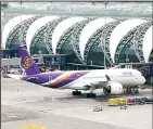  ??  ?? In this file photo, a Thai Airways jet parks at Suvarnabhu­mi Airport in Bangkok, Thailand. Thai Airways has disclosed that its chairman has resigned as the carrier struggles with financial challenges. (AP) B