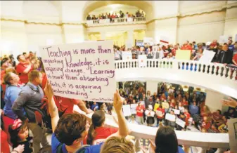  ?? Nate Billings / Associated Press ?? Oklahoma teachers and supporters of increased education funding pack the state Capitol during a walkout in Oklahoma City. Teachers also want more funding for classrooms.