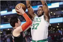  ?? ELISE AMENDOLA /AP PHOTO ?? Celtics forward Semi Ojeleye (37) blocks the path of Bulls guard Ryan Arcidiacon­o in the second half of Friday’s game at Boston. The Celtics won 111-104.