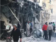  ?? Reuters ?? The aftermath of an air strike on the besieged rebel-held Al Qaterji neighbourh­ood of Aleppo