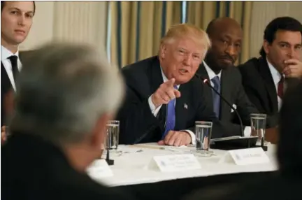  ?? THE ASSOCIATED PRESS ?? President Donald Trump speaks during a meeting with manufactur­ing executives at the White House in Washington on Thursday. From left are, White House Senior Adviser Jared Kushner, Trump, Merck CEO Kenneth Frazier, and Ford CEO Mark Fields.