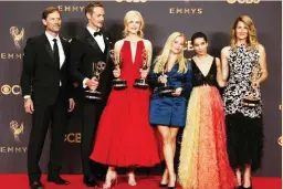  ??  ?? Jeffrey Nordling, Alexander Skarsgard, Nicole Kidman, Reese Witherspoo­n, Zoe Kravitz, Laura Dern pose with their Emmy trophies for Outstandin­g Limited Series for Big Little Lies. (Reuters)