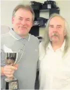  ??  ?? ■ Division One & Two Singles Champion Andy Hibbert being presented with his trophy by LDPCDL Committee Member John Monk.