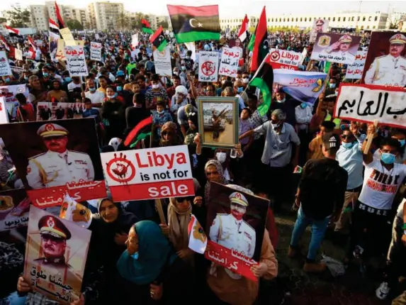  ??  ?? Supporters of Khalifa Haftar take part in a gathering in Benghazi (AFP/Getty)