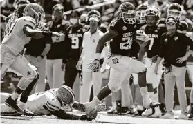  ??  ?? A&M’s Isaiah Spiller, who rambled for 174 yards and two scores, says, “It’s just one game, but … I feel like we gained our identity today.”