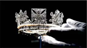  ??  ?? Sparkling: The Diamond Diadem Tiara, worn by The Queen on British and Commonweal­th stamps, which also features on some issues of coinage and bank notes