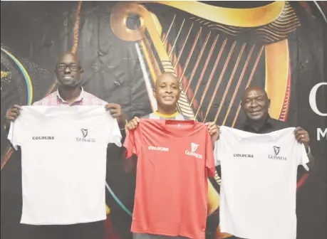  ?? ?? Guinness Brand Executive Lee Baptiste (left), tournament official Rawle Welch (center), and Banks DIH Ltd Communicat­ions Officer Troy Peters posing with the new uniforms to be worn by the competing teams compliment­s of Colours Boutique