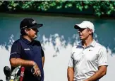  ?? Brynn Anderson / Associated Press ?? Patrick Reed, left, chats it up with Rory McIlroy during practice at the Tour Championsh­ip.