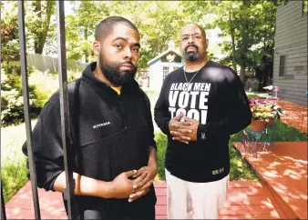  ?? Arnold Gold / Hearst Connecticu­t Media ?? Attorney Michael Jefferson, right, with his son, Michael Jefferson II, at their home in New Haven on June 4.