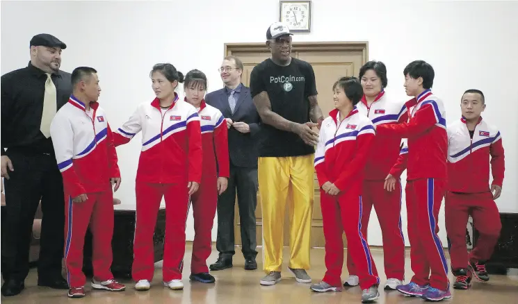 ?? KIM KWANG HYON/ THE ASSOCIATED PRESS ?? Former NBA star Dennis Rodman, centre, with North Korean Olympic athletes on June 15 during a visit to Pyongyang, North Korea.