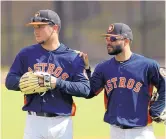  ?? DAVID J. PHILLIP/ASSOCIATED PRESS ?? Houston third baseman Alex Bregman, left, and second baseman Jose Altuve, right, will be key figures for the Astros this season.