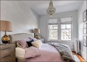  ??  ?? Continuing with the girly-glam theme, the designers added a sparkly chandelier, faux fur throw and pale lavender bedding in Louisa Bargeron’s bedroom.