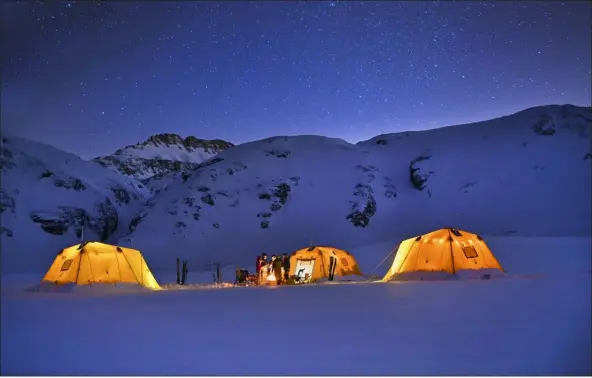  ?? BRETT SCHRECKENG­OST, PROVIDED BY TELLURIDE HELITRAX ?? Bridal Veil Backcountr­y Ski Camp at 12,500feet in the backcountr­y near Telluride offers guided tours with heated tents, hot meals, down jackets and insulated boots.