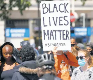  ?? AP ?? An anti-racism protest in central London on Sunday. The recent death in America of a black man, George Floyd, continues to prompt protests for an anti-racist agenda across all sectors of society.