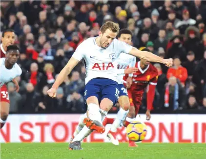  ??  ?? Tottenham’s Harry Kane scores his side’s second goal during the English Premier League soccer match between Liverpool Photo: AP