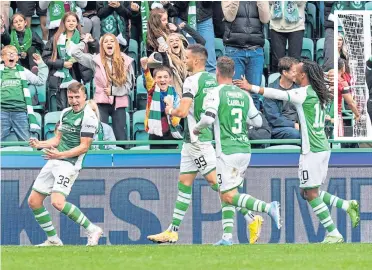  ?? ?? Josh Campbell celebrates with his team-mates after scoring Hibs’ third goal
