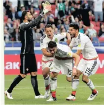  ?? PICTURE: REUTERS ?? LAST GASP: Mexico’s Hector Moreno, along with Javier Hernandez and Oribe Peralta, celebrates scoring his side’s second goal against European Champions Portugal in their Fifa Confederat­ions Cup encounter last night.