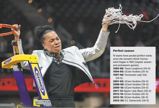  ?? KEN BLAZE/USA TODAY SPORTS ?? Head coach Dawn Staley cuts the net after her South Carolina Gamecocks defeated Iowa in the final of the Women’s NCAA Tournament. It is her third national title as their head coach.