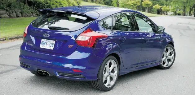  ?? Zack Spencer/ Postmedia News ?? Fuel-efficient, quick and agile, the Ford Focus ST delivers a roomy, refined cabin with large, intuitive gauges, well-bolstered seats and plenty of cargo room.