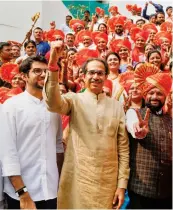  ?? — PTI ?? Shiv Sena chief Uddhav Thackeray, Aditya Thackeray and Eknath Shinde visit the Thane Municipal Corporatio­n to congratula­te the newly-appointed mayor Naresh Mhaske on Thursday.