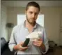  ??  ?? On May 10, 2013, Cody Wilson, the founder of Defense Distribute­d, shows a plastic handgun made on a 3D-printer at his home in Austin, Texas.