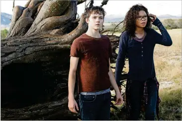  ?? CONTRIBUTE­D BY WALT DISNEY PICTURES ?? Storm Reid is Meg Murry and Levi Miller is Calvin O’Keefe in Disney’s “A Wrinkle in Time.”