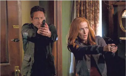  ??  ?? Mulder (David Duchovny) and Scully (Gillian Anderson) are back investigat­ing “The X-Files.” SHANE HARVEY/FOX