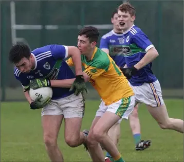  ??  ?? Shane Doyle of Glynn-Barntown is tackled by Dean Corish (Our Lady’s Island/St. Fintan’s).