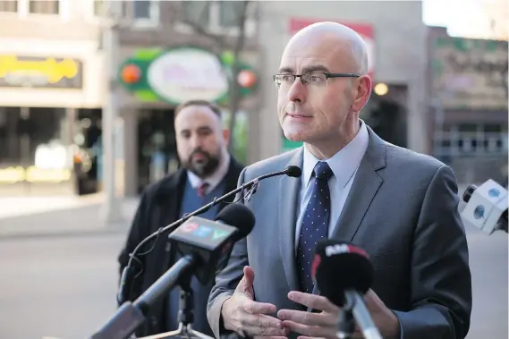 ?? DAX MELMER ?? Minister of Economic Developmen­t and Growth Steven Del Duca announces Windsor is getting more than $212,000 for the revitaliza­tion of main street revitaliza­tion.