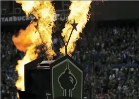  ?? TED S. WARREN — THE ASSOCIATED PRESS ?? Fire effects go off behind two stars signifying the Seattle Sounders’ two MLS Cup championsh­ip victories to begin their season-opening MLS match against the Chicago Fire Sunday.