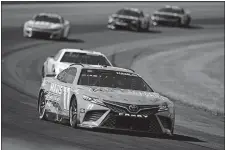  ?? DERIK HAMILTON/AP PHOTO ?? Denny Hamlin (11) drives during a NASCAR Cup Series race at Pocono Raceway on July 23 in Long Pond, Pa.