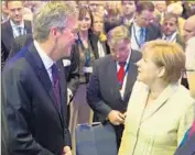  ?? Axel Schmidt Getty Images ?? JEB BUSH greets German Chancellor Angela Merkel. His speech in Berlin kicks off a three-nation visit.