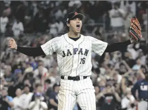  ?? ERIC ESPADA/GETTY IMAGES ?? Shohei Ohtani of Team Japan reacts after the final out of the World Baseball Classic Championsh­ip defeating Team USA, 3-2, on Tuesday in Miami.