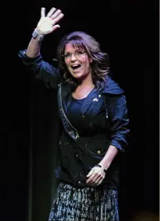  ?? Darren Hauck / Getty ?? A long-awaited showdown in a Manhattan courtroom between Sarah Palin and The New York Times over a 2017 editorial she says defamed her was delayed Monday when the former Alaska governor tested positive for COVID-19.