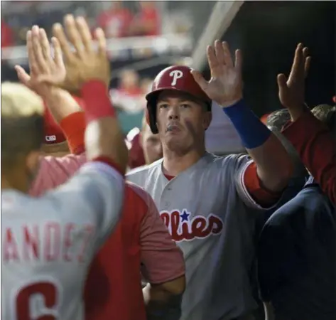  ?? NICK WASS — THE ASSOCIATED PRESS ?? The Phillies’ Justin Bour, center, celebrates his home run during the third inning against the Nationals on Wednesday night in Washington.