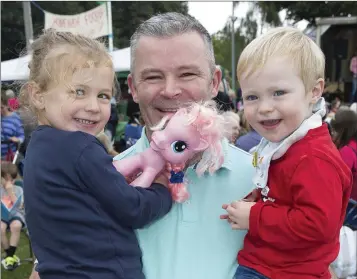  ??  ?? Sienna, John and Hugo Halligan having a good time at the Rathmichae­l Parish Fete.