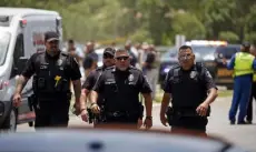  ?? Dario Lopez-mills, The Associated Press ?? Police walk near Robb Elementary School following Tuesday’s shooting.