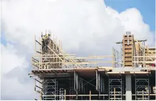  ??  ?? Workers continue adding floors at Capital Park, a massive mixed-use developmen­t in James Bay.