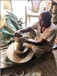  ??  ?? Sri Krishna, a potter, making diyas.