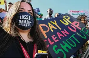  ?? Peter Dejong/Associated Press ?? Activists call for compensati­on for climate damage during a Nov. 12 demonstrat­ion at the U.N. Climate Change Conference in Sharm el-Sheikh, Egypt.