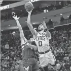  ?? JEFF HANISCH/USA TODAY SPORTS ?? The Celtics’ Jayson Tatum, right, shoots around the Bucks’ Grayson Allen Friday in Milwaukee.