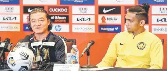  ?? — Bernama file photo ?? Ahmad Khuzaimi Piee (right) and coach Kim Pan Gon during a press conference.