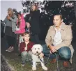  ??  ?? Dad Alex Sit, partner Carmelina Kannelmae, grandma Gabrielle Sit and kids Theodore and Liila Moelder-Sit with dog Buddy.