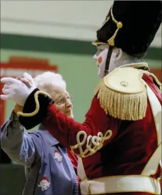  ?? JONATHAN TRESSLER — THE NEWS-HERALD ?? Rob Hruby, as The Toy Soldier, dances with Painesvill­e Township resident Kay Sexton Dec. 22 at the Lake County YMCA Central Y in Painesvill­e.