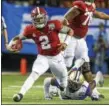  ?? BUTCH DILL — ASSOCIATED PRESS ?? Alabama quarterbac­k Jalen Hurts scrambles for yardage against Washington last season during the Peach Bowl.