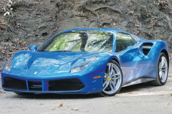  ?? PHOTOS: DAVID BOOTH/DRIVING ?? The 2018 Ferrari 488 Spider is gorgeous and converts to open-topped mode with just the toggle of a button.