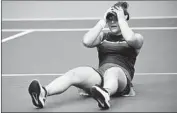  ?? Emilee Chinn Getty Images ?? BIANCA ANDREESCU is stunned after beating Serena Williams for her first major championsh­ip.