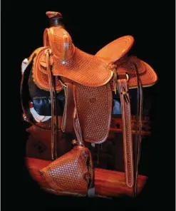  ??  ?? Carson Thomas, ½-scale tooled leather saddle, 22 x 24 x 24”