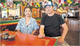 ?? JULIEN GIGNAC/ TORONTO STAR ?? Tsering Dolker, left, and Namgyal Jampa own Shangrila, a Tibetan restaurant near Roncesvall­es Ave. and Queen St. W.