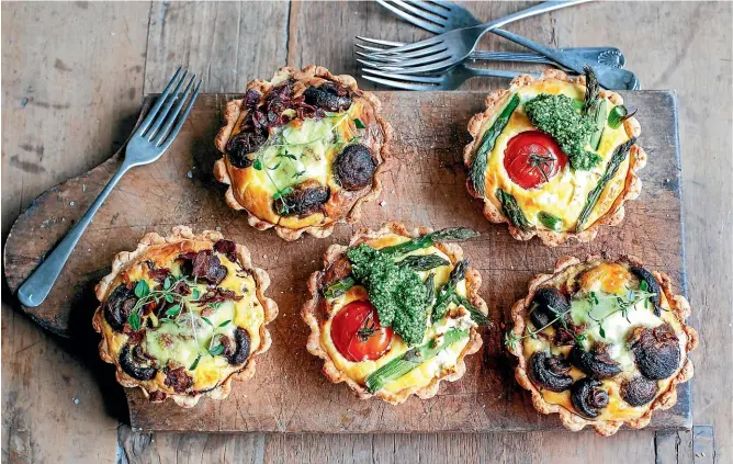  ?? SARAH TUCK ?? Why choose when you can have both – mushroom, pancetta and red onion tarts and/or asparagus, tomato and feta tarts with basil pesto make a great lunch.